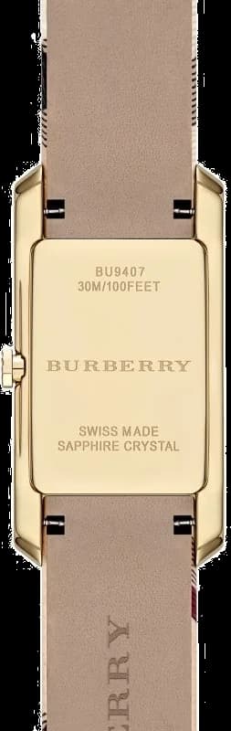 Cadran Burberry BU9407 avec index bâtons dorés, aiguilles fines et date à 3h, design épuré raffiné