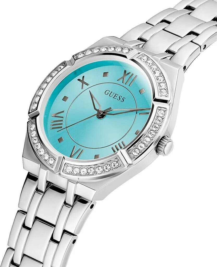 Cadran Guess GW0033L7 avec index dorés et aiguilles fines, contraste élégant sur fond turquoise