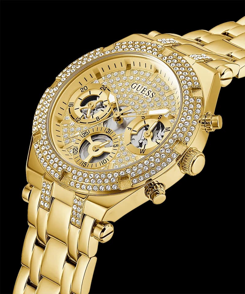 Cadran Guess GW0440L2 au design ouvert dévoile les rouages, index bâtons dorés et aiguilles fines, multifonction jour-date