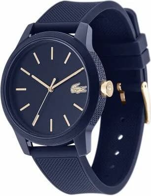 Cadran Lacoste 2011011 avec index appliqués bâtons, aiguilles dauphine argentées et date à 3h, fond bleu soleil