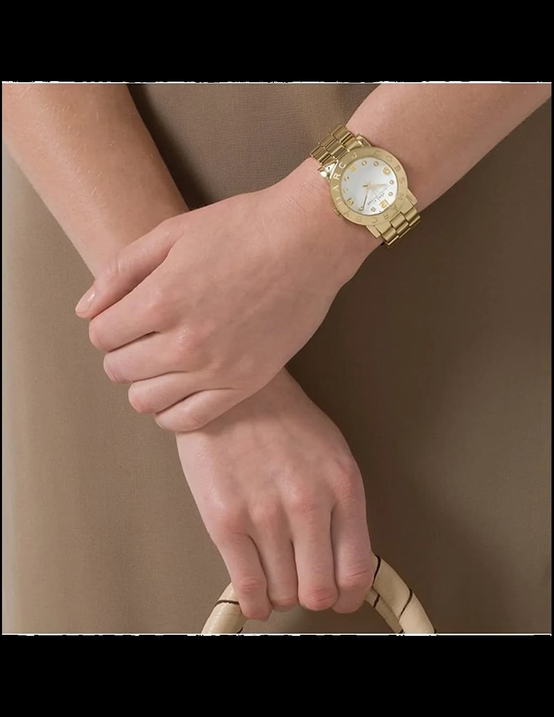 Boîtier Marc Jacobs MBM3056 rond en acier doré et verre minéral, profil fin et élégant
