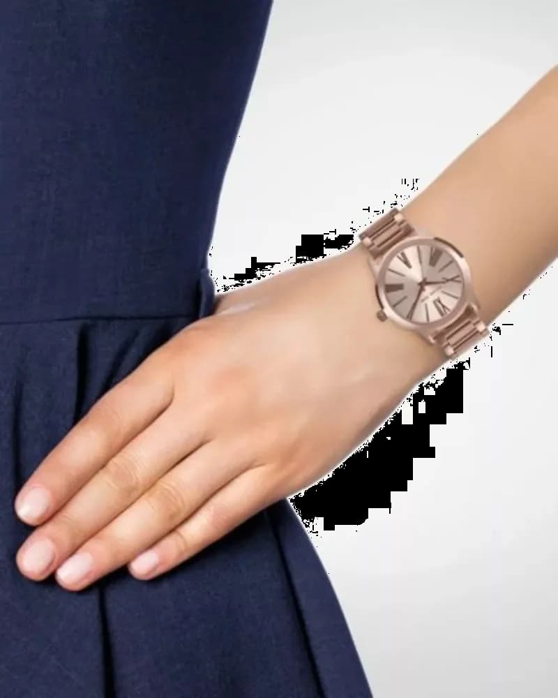 Bracelet Michael Kors MK3491 en acier or rose maillé, fermoir déployant, aspect luxueux