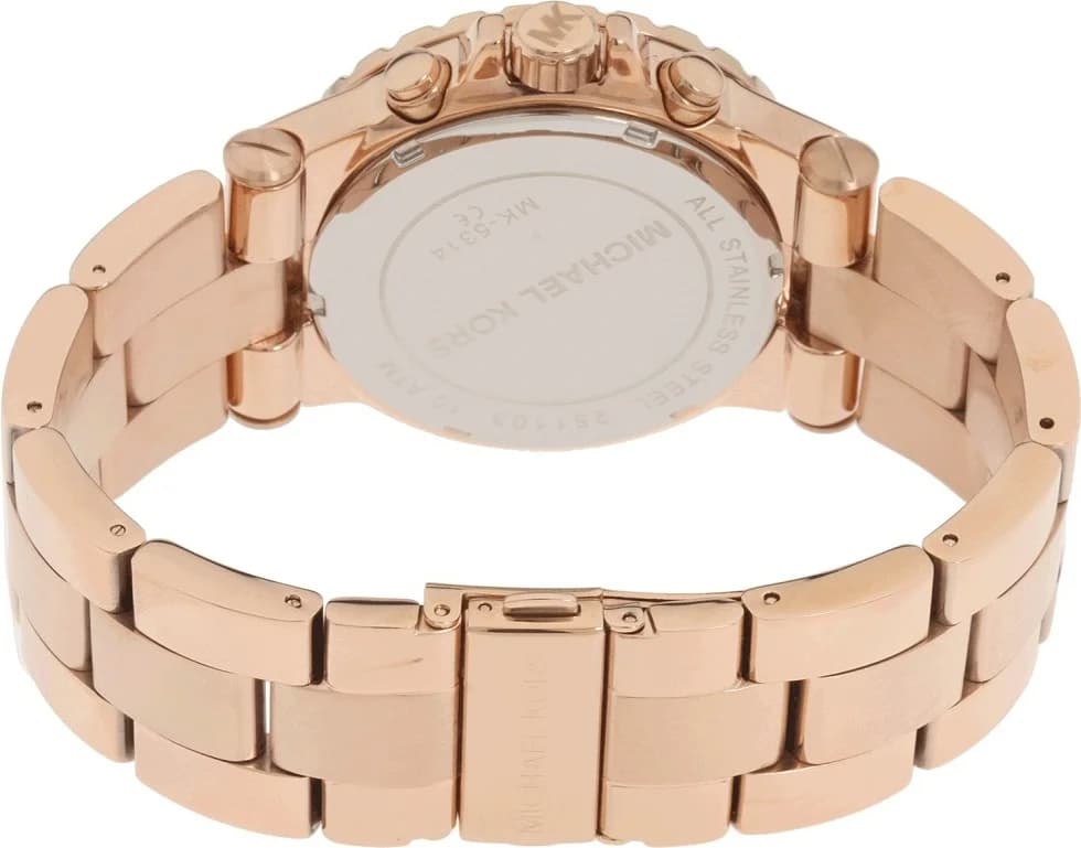 Cadran Michael Kors MK5314 aux index dorés, aiguilles luminescentes, guichet date à 3h, design épuré et élégant