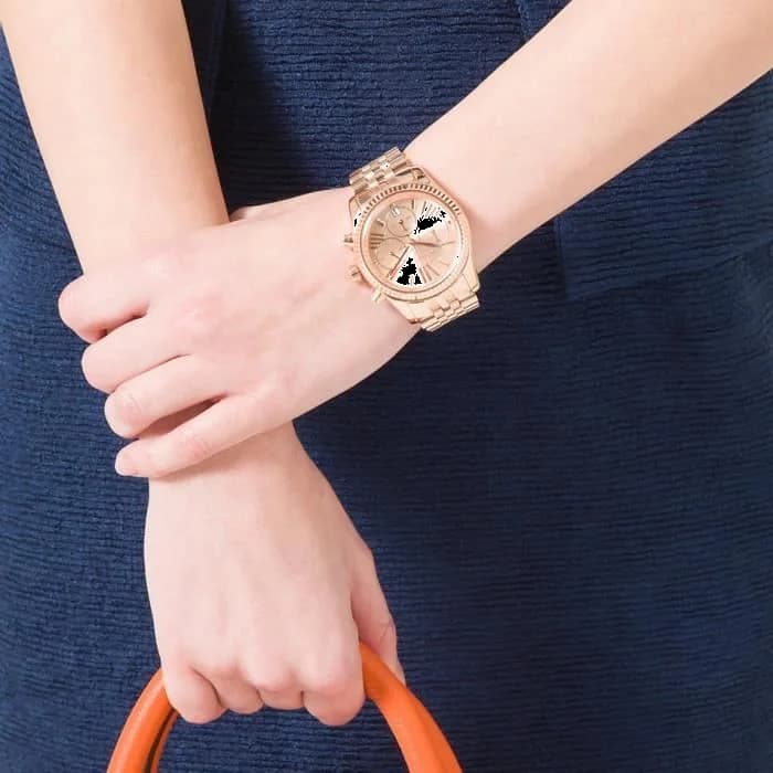Boîtier Michael Kors MK5569 en acier PVD or rose de 40 mm, lunette lisse polie, couronne crantée, profil fin et élégant