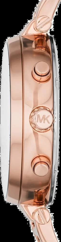Cadran Michael Kors MK6226 avec index appliqués dorés, aiguilles bâtons et date à 3h sur fond rose dégradé