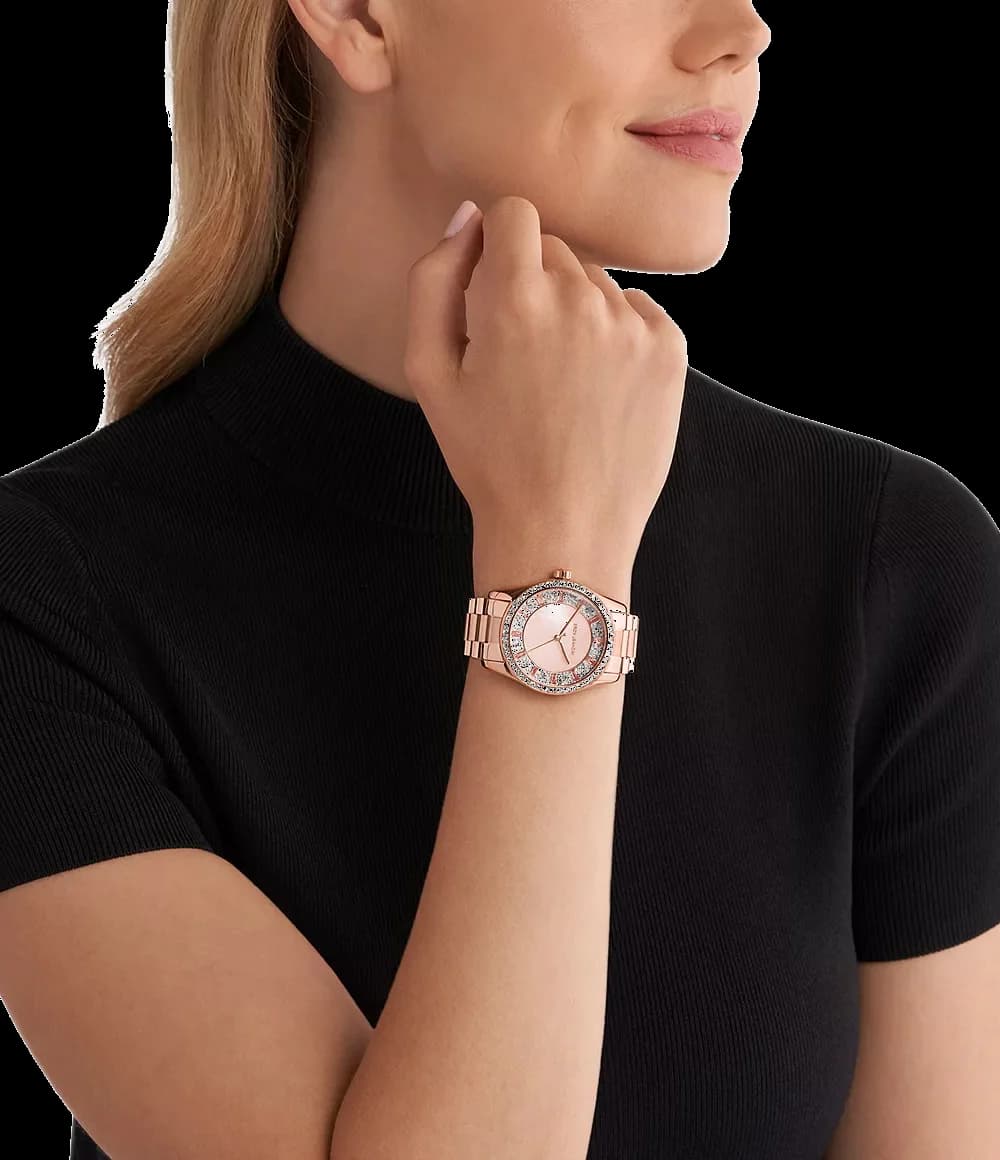 Boîtier Michael Kors MK7444 rond en acier or rose 38 mm, lunette pavée de cristaux, verre minéral, couronne cannelée, profil fin