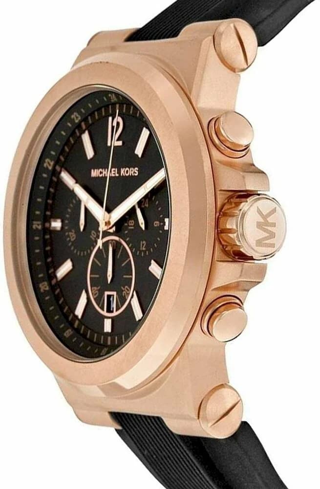Cadran Michael Kors MK8184 avec index bâtons dorés et aiguilles squelettes, date à 3h, fond noir soleillé