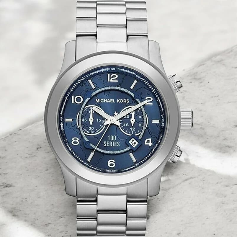 Boîtier Michael Kors MK8314 en acier inoxydable poli, lunette fixe lisse, couronne crantée, profil épais 12 mm