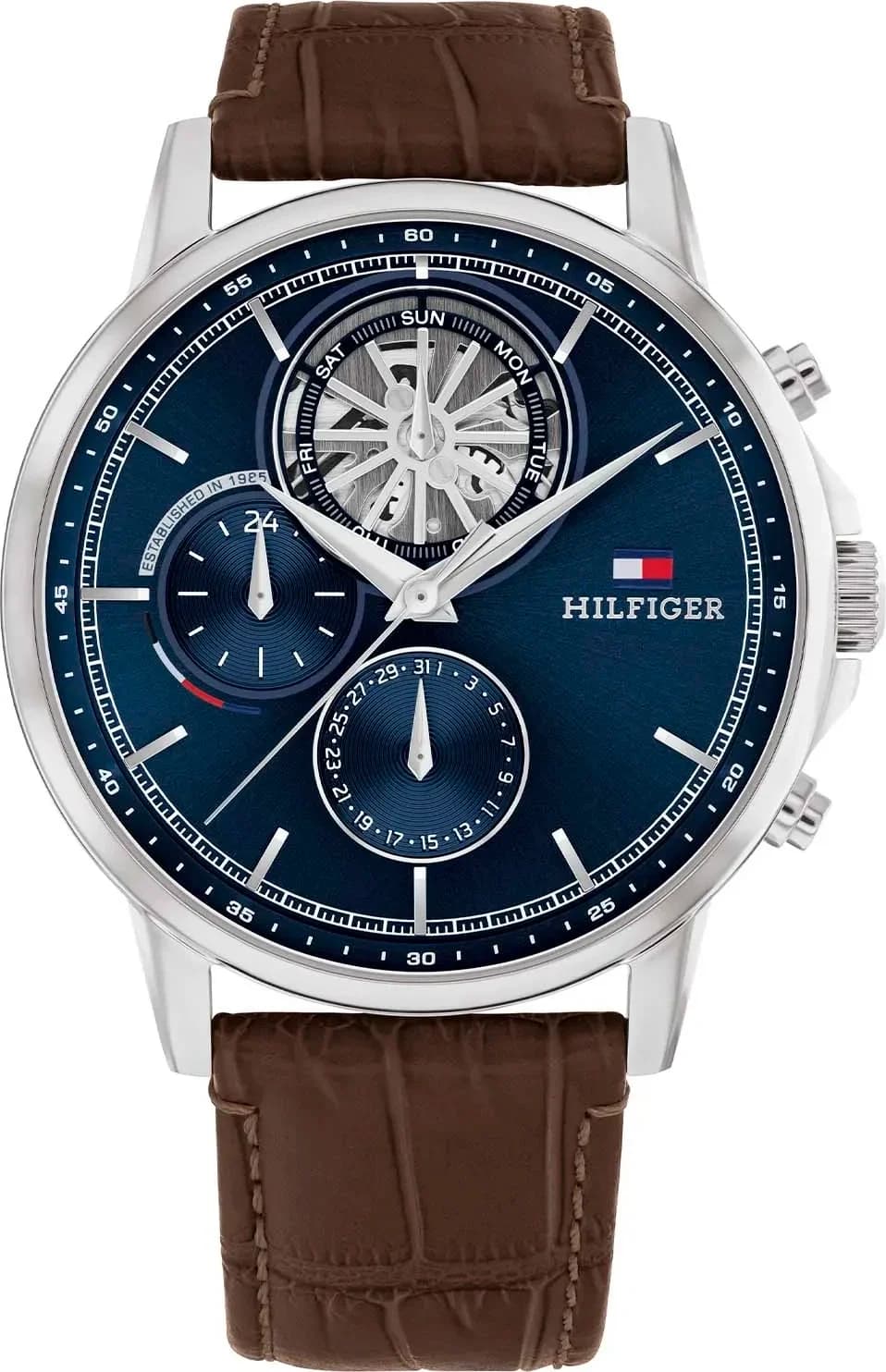 Montre Tommy Hilfiger 1710629 au cadran bleu soleil, index bâtons et logo blanc, style classique sport