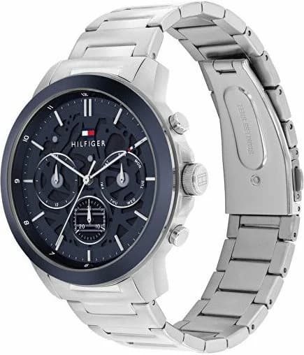Cadran Tommy Hilfiger 1710684 affiche un cadran bleu soleil, index bâtons argentés, aiguilles et date à 3h