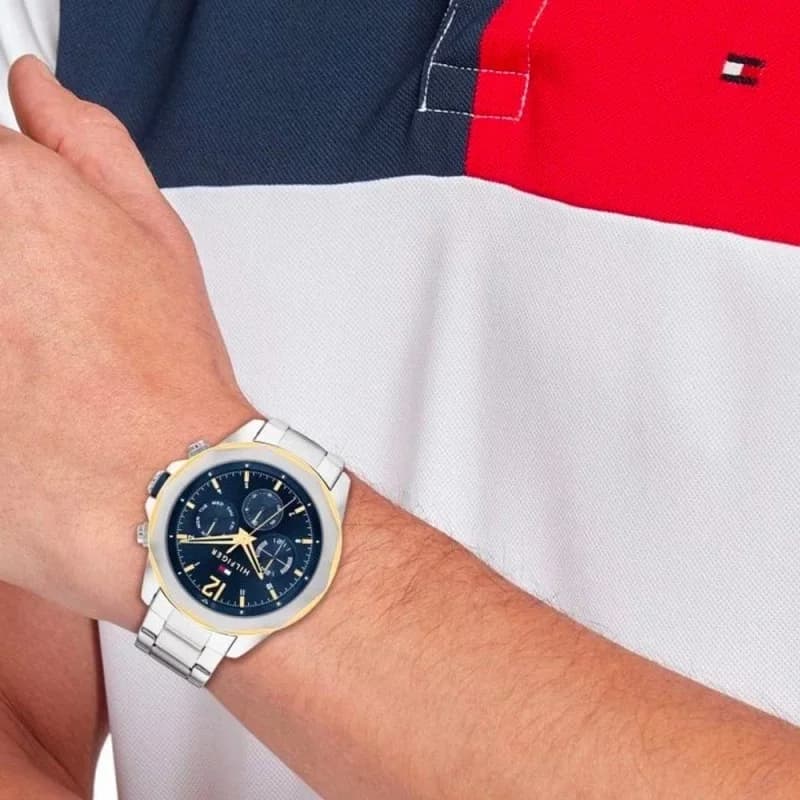 Boîtier Tommy Hilfiger 1792059 en acier bicolore argenté et doré, lunette lisse, fond plein, profil fin et élégant